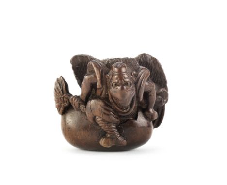 A Wood netsuke of Sojobo (the tenju king) hatchingEdo period (1615-1868), mid-late 19th centuryShown emerging from a large sh