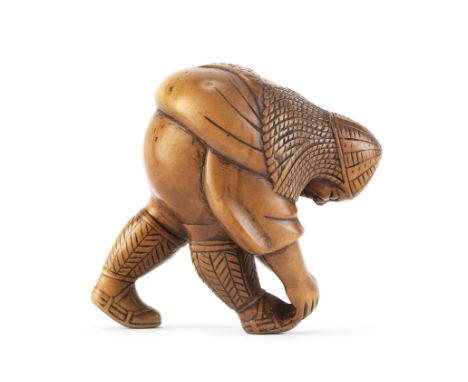 A wood netsuke of a soldierBy Bokusan Sekko, Edo period (1615-1868), mid-19th centuryProbably representing a foreign soldier,
