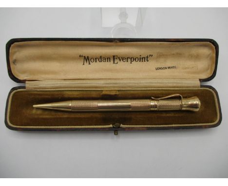 A 9ct gold cased Mordan Everpoint propelling pencil with a clip, engine turned decoration and a detachable top, enclosing a r