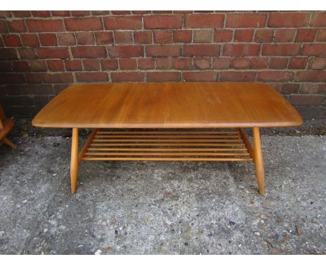 Lucian Ercolani for Ercol Furniture - an Ercol Windsor coffee table, model 459, in elm and beech, the table with bar shelf un