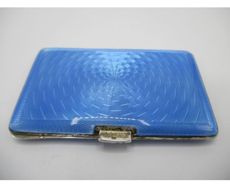 An early 20th century blue enamelled silver card case with import marks, of cushioned form, with engine turned decoration, 96