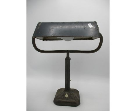 An early to mid 20th century Bankers desk lamp with green painted adjustable metal shade, circa 1930 