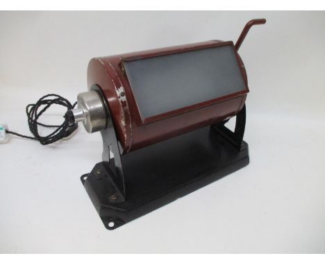 An Art Deco period Zeiss dark room lamp, red painted and mounted on an ebonized base, re-wired and pat tested 