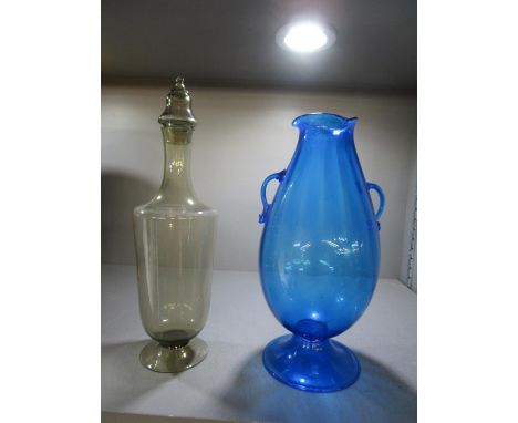 A Venetian blue glass vase, pear shaped body with moulded vertical flutes, crimped three sided top rim, twin handles and fold