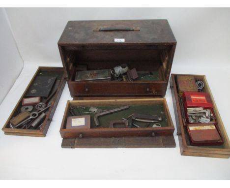 A Freeman &amp; Co, Gloucester - a small vintage engineering wooden tool cabinet, with drop front and five graduated drawers 