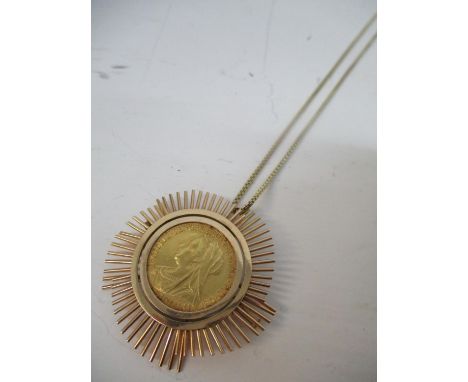 A Victorian gold full sovereign with St George to the obverse 1900, in a gold coloured metal surround, 18.5g 