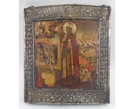 18TH CENTURY RUSSIAN ICON, with saintly figure and surrounding allegorical scenes, painted on wooden panel with embossed silv
