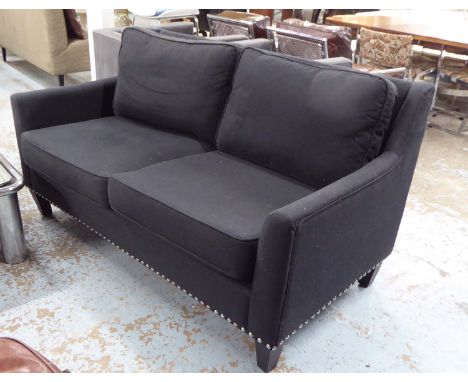 SOFA, two seater, in charcoal grey studded with square supports, 158cm L.