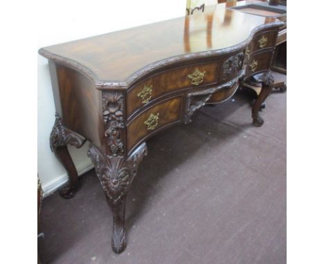 MAITLAND-SMITH SIDEBOARD, Chippendale style mahogany with a serpentine shaped top and six drawers below on leaf decorated cab