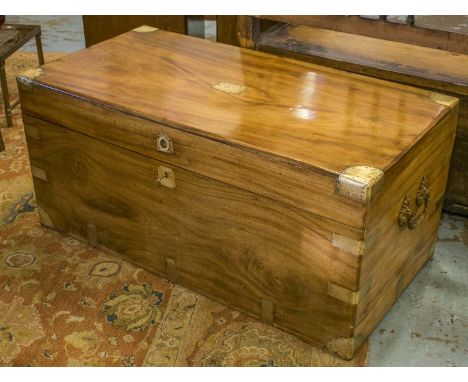TRUNK, 19th century camphorwood and brass bound with a rectangular rising top enclosing space for storage and an ornate carry