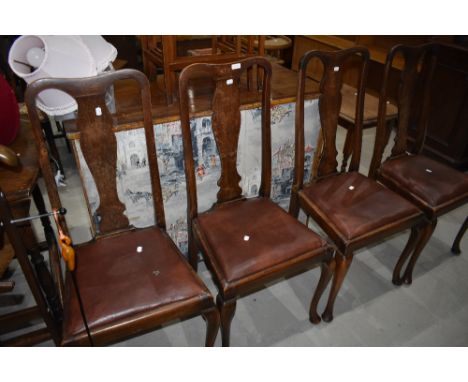 A set of four early 20th Century Queen Anne style vase back dining chairs