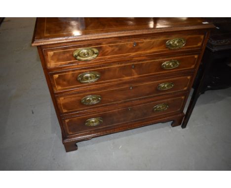 A 19th Century mahogany and satinwood inlaid chest of four long drawers on bracket feet in the Regency style, width approx. 9