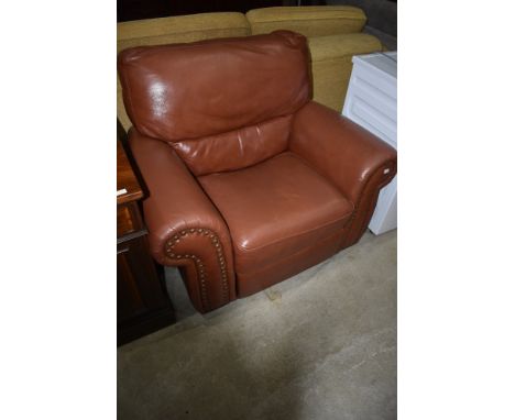 A modern leather manual recliner armchair