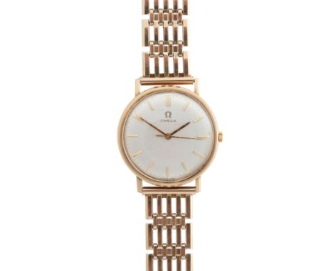 Omega: A gentleman's gold watch manual wind, 9ct gold case, round silver-coloured dial with applied gold baton hour markers, 