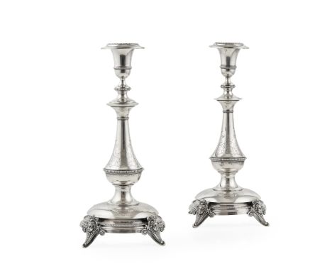 A pair of German candlesticks stamped M 800, possibly Gustav Memmert of Berlin, each of baluster form, beaded borders with en