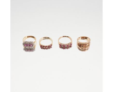 A ruby and diamond set ring claw set with three oval-cut rubies, in a border of round brilliant-cut diamonds to a plain 18ct 