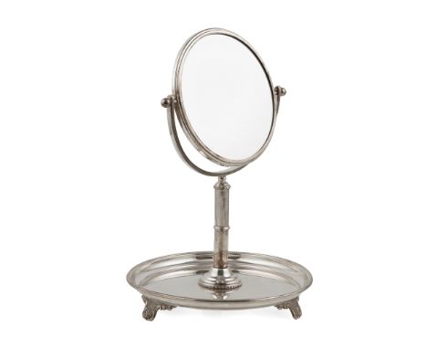 A late 20th Century silver mounted shaving mirror Birmingham 1996, the tray of circular outline with beaded border, raised on