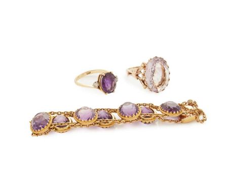 An amethyst set bracelet claw set with seven oval amethysts in a rope-twist border, joined by two rows of belcher links and a