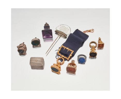 A collection of 19th Century and other seals to include a Georgian fob seal, with a blank agate matrix, well chased mounts an