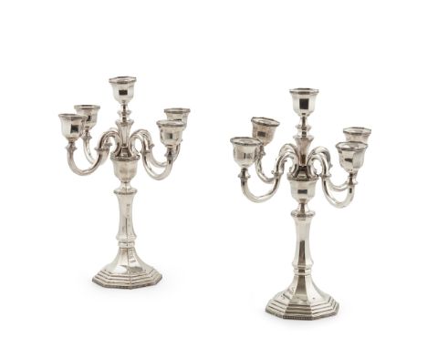 A George I style four branch candelabra stamped 925, of hexagonal form, knopped baluster stem, the four-branch light fitting 