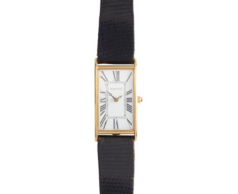 Tiffany: A gentleman's gold cased wrist watch originally purchased 1991, 18ct gold case, quartz movement, rectangular white d