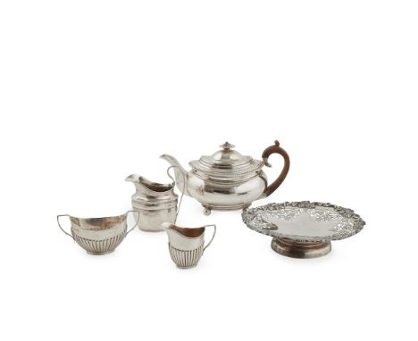 A late George III teapot I.R., London 1817, of oval form, gadrooned border and raised on four ball feet; together with a matc