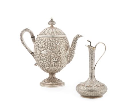 A 19th Century Indian teapot unmarked, of ovoid form, heavily embossed and chased foliate decoration throughout, with hunting