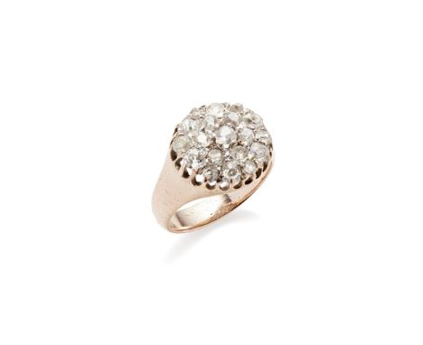 A diamond set cluster ring pavé set throughout with old round and cushion-cut diamonds, to a plain metal shank stamped 18ct(R