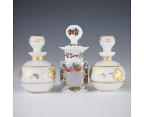 DESCRIPTION: Lot of milk glass perfume bottles. The pair are Irving Price milk glass bottles with gilded accents and floral e