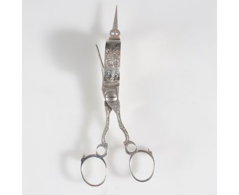DESCRIPTION: Antique silverplated wick trimmer. Features embossed baroque vine designs, and rests on three wheels. CIRCA: 19t