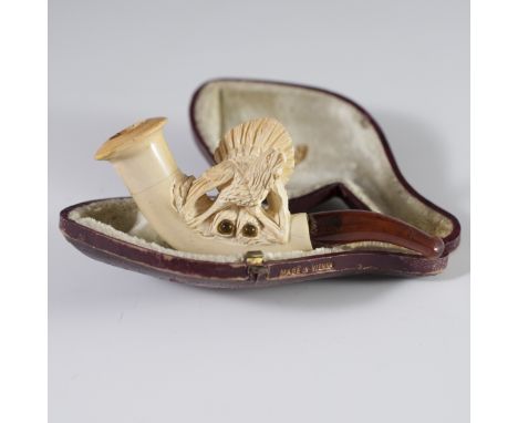 DESCRIPTION: H.A. Co. Viennese meerschaum and amber tobacco pipe. Features an amber mouthpiece and a carved meerschaum pipe, 