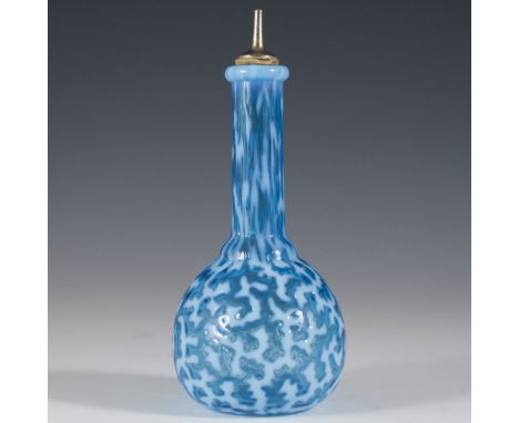 DESCRIPTION: Vibrantly hued glass barber bottle. Features a textured exterior with a cerulean blue and white accents. Finishe