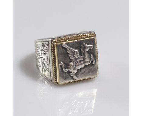 DESCRIPTION:Konstantino ring comprising of a sterling band with engraved floral motif along with tridents along the side. The