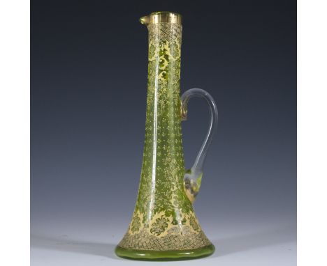 DESCRIPTION: Victorian glass pitcher featuring a slim tapering body and neck with an arching handle. Decorated with a light g