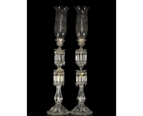 DESCRIPTION: Pair of baccarat crystal candle holders featuring a very elegant heavy faceted shaft design and two levels of cr
