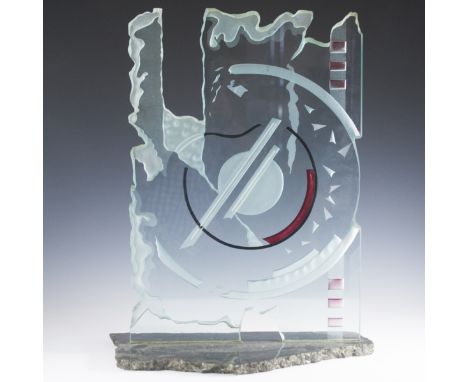 DESCRIPTION:Modernist glass sculpture featuring roughly cut edgework and frosted glass decoration with abstract designs and r