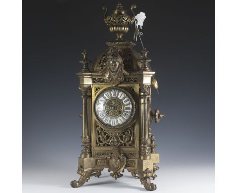 DESCRIPTION:Dore brass mantel clock by H&F Paris. Features a Rococo scrolled motif with reticulated accents throughout the en