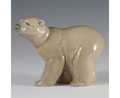 DESCRIPTION: Lladro porcelain figurine of a bear gazing off into the distance. Finished with a glossed glaze and marked:"Llad