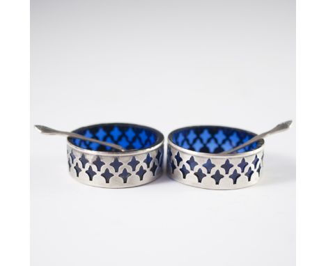 DESCRIPTION: Sterling salt and pepper cellars. Features fleur de lises reticulations and cobalt blue glass inserts. Includes 
