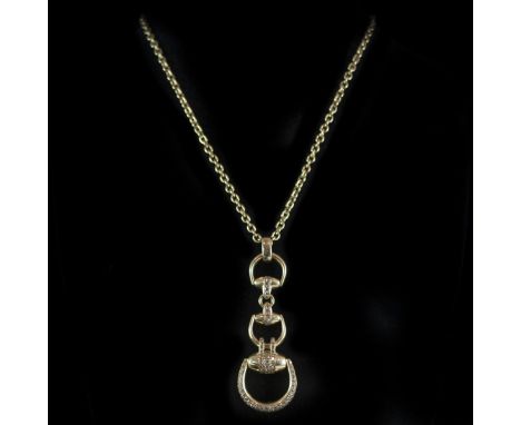 DESCRIPTION:18kt yellow gold necklace from the Gucci "Horsebit" collection. Features an 18kt yellow gold chain with a pendant