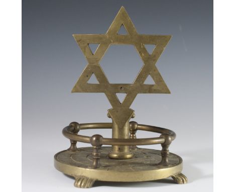 DESCRIPTION: Judaic ornament comprised of heavy brass Star of david standing atop a base with engraved detailing and brass ra