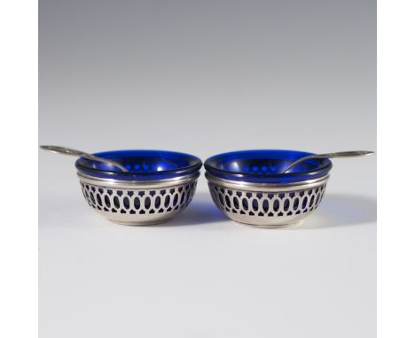 DESCRIPTION: Webster sterling salt and pepper cellars featuring ornate geometric reticulations and cobalt glass inserts. Incl