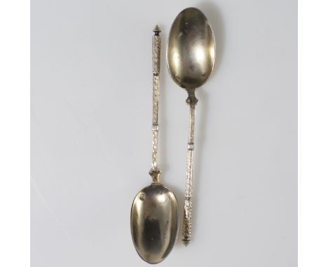 DESCRIPTION: Pair of 800 silver demitasse spoons. Features elegant olive branch motif segmented handles. Marked:"800" along w