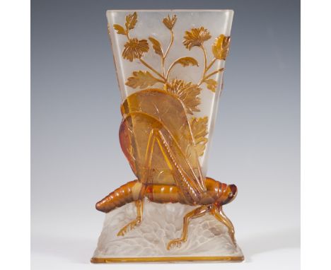 DESCRIPTION: "Sauterelle" Baccarat crystal vase featuring a cow bell shape with raised cameo amber glass sunflowers, resting 