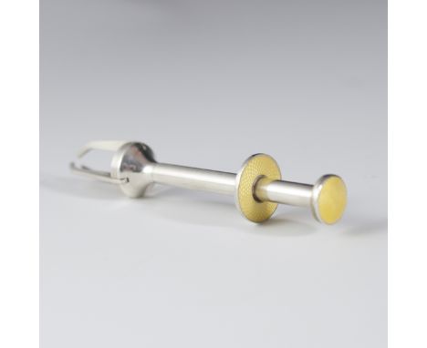 DESCRIPTION: Silverplated sugar cube tongues. Features a yellow enamel decoration along the button and handle. When button is