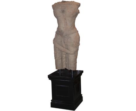 DESCRIPTION: An antique terracotta sculpture from Thailand of a male figure draped in jewels and body tassles. Rests on a lac