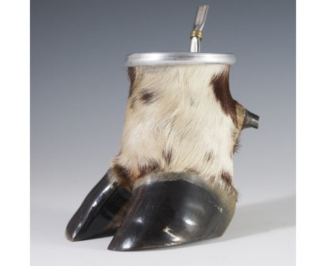 DESCRIPTION: Mate cup and straw comprised of a cow hoof.CIRCA: 20th Ct.ORIGIN: ArgentinaDIMENSIONS:H:6" L:6.5"CONDITION: See 