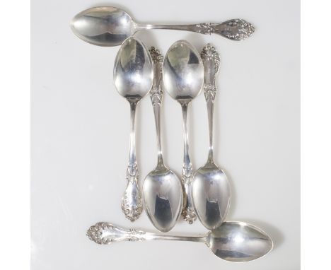 DESCRIPTION: Set of 6 sterling spoons by Watson Co. Features embossed cartouche along the handle with scrolled floral accents