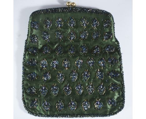 DESCRIPTION: Satin nightbag in a deep green hue with green stringed beads and brass clasps.CIRCA: 20th Ct.ORIGIN: UnknownDIME