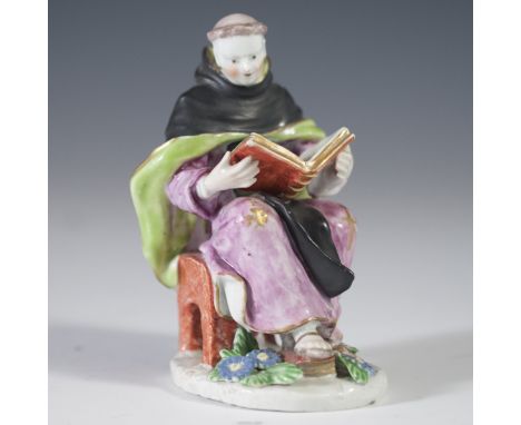 DESCRIPTION: Antique 18th century porcelain figurine of a friar draped in flowing garments, reading the "Pater Noster" or "Ou